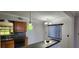 Well-lit kitchen featuring oak cabinets, tile backsplash, and granite countertops at 6825 Hammock Rd, Port Richey, FL 34668