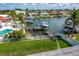 Backyard view showing a pool and dock on the waterfront canal at 710 116Th Ave, Treasure Island, FL 33706
