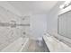 Modern bathroom with marble tiled walls, new fixtures, and a clean, updated design at 710 116Th Ave, Treasure Island, FL 33706