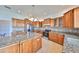 Well-equipped kitchen with granite countertops, stainless steel appliances, and ample cabinet space at 710 116Th Ave, Treasure Island, FL 33706