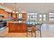 Bright kitchen featuring granite countertops and views to the fenced-in yard at 710 116Th Ave, Treasure Island, FL 33706