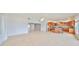 Spacious living room features tile flooring, white walls and ceiling fan at 710 116Th Ave, Treasure Island, FL 33706