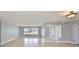 Bright, open living room featuring tile flooring, natural lighting, and a spacious layout at 710 116Th Ave, Treasure Island, FL 33706