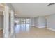 Bright living room with tile flooring, decorative columns, and large glass doors with backyard views at 710 116Th Ave, Treasure Island, FL 33706