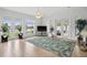 Bright living room with tile flooring, large windows, and access to the outdoor area at 710 116Th Ave, Treasure Island, FL 33706