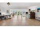 Open living room with tile floors, bright white walls and plenty of natural light from the sliding glass doors at 710 116Th Ave, Treasure Island, FL 33706