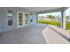 Covered patio area with concrete flooring and views of the waterfront property at 710 116Th Ave, Treasure Island, FL 33706