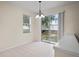 Bright dining room featuring sliding glass doors that offers ample natural light at 7249 Bridgeview Dr, Wesley Chapel, FL 33545