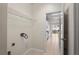 Laundry room with wire shelving and hookups, located off of kitchen at 7249 Bridgeview Dr, Wesley Chapel, FL 33545