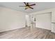 Open living area showcases hardwood floors, ceiling fan, and open layout at 7249 Bridgeview Dr, Wesley Chapel, FL 33545
