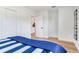 Bedroom with hardwood floors, white walls, two large closets, and view to living space at 7500 16Th N St, St Petersburg, FL 33702