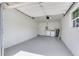 Clean garage interior featuring painted walls, laundry hookups, and ample space for parking and storage at 7500 16Th N St, St Petersburg, FL 33702