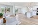 Open living space with large windows, wood flooring, and cozy seating arrangement at 7500 16Th N St, St Petersburg, FL 33702
