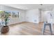 Bright open living space featuring light floors and open site lines between kitchen and living room at 7500 16Th N St, St Petersburg, FL 33702