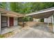 Backyard features include a carport and covered patio with lush bamboo at 7511 N Ola Ave, Tampa, FL 33604