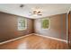 Bedroom features include a ceiling fan and two windows providing natural light at 7511 N Ola Ave, Tampa, FL 33604