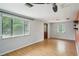 Bright and airy living room with hardwood floors and large windows for ample natural light at 7511 N Ola Ave, Tampa, FL 33604