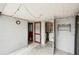 The outdoor patio features string lights, exterior doors, and entry to the utility room at 7511 N Ola Ave, Tampa, FL 33604