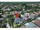 Charming single-Gathering home featuring a screened-in pool, lush landscaping, and serene backyard oasis at 10219 Millport Dr, Tampa, FL 33626