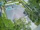 Aerial view of a well-maintained home with a pristine roof and screened-in pool at 10219 Millport Dr, Tampa, FL 33626