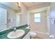 Well-maintained bathroom includes a vanity, shower-tub combo and a window for natural light at 10219 Millport Dr, Tampa, FL 33626