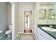 Bathroom featuring tile floors, a toilet, and a vanity sink at 10219 Millport Dr, Tampa, FL 33626