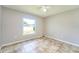Cozy bedroom featuring a bright window, neutral paint, ceiling fan and tile flooring at 10219 Millport Dr, Tampa, FL 33626