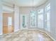 Bright breakfast nook features tiled floors and leads to the living room at 10219 Millport Dr, Tampa, FL 33626