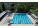 Spacious community pool featuring lap lanes, a splash area, and ample lounge seating at 10219 Millport Dr, Tampa, FL 33626