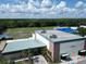 Westchase Gym featuring well-manicured landscaping, athletic field, and shade structures at 10219 Millport Dr, Tampa, FL 33626