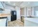 Bright kitchen with tiled floors and modern appliances at 10219 Millport Dr, Tampa, FL 33626
