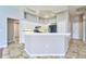 Bright kitchen with white cabinets, tile backsplash, and modern appliances, perfect for cooking and entertaining at 10219 Millport Dr, Tampa, FL 33626