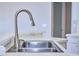 Close up of stainless steel kitchen sink with modern faucet at 10219 Millport Dr, Tampa, FL 33626