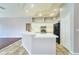 Modern kitchen with white cabinets and black appliances at 10219 Millport Dr, Tampa, FL 33626