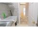 Laundry room featuring a utility sink and views into the interior spaces at 10219 Millport Dr, Tampa, FL 33626