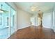 Open living room featuring wood floors and sliding doors at 10219 Millport Dr, Tampa, FL 33626