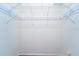 Empty walk-in closet with wire shelving and white walls at 10219 Millport Dr, Tampa, FL 33626
