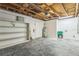 Spacious basement features open shelving and a utility sink for added convenience at 106 Avery Ave, Crystal Beach, FL 34681