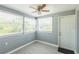 Well-lit room featuring new flooring, ceiling fan, and multiple windows at 106 Avery Ave, Crystal Beach, FL 34681