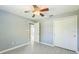 Bedroom with modern flooring, ceiling fan, closet, and neutral colors at 106 Avery Ave, Crystal Beach, FL 34681