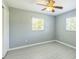 Cozy bedroom with modern flooring, ceiling fan, and a double window at 106 Avery Ave, Crystal Beach, FL 34681