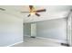 Open living room with updated floors, ceiling fan, and gray paint at 106 Avery Ave, Crystal Beach, FL 34681