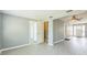 Open concept living room and hallway with white trim and modern flooring at 106 Avery Ave, Crystal Beach, FL 34681