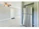 Open-concept living area with new flooring and stainless steel refrigerator at 106 Avery Ave, Crystal Beach, FL 34681