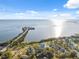 Beautiful aerial view of waterfront homes with scenic bay views and bright sunny skies at 108 Shore Dr, Tarpon Springs, FL 34689