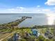 Charming waterfront homes and community with stunning bay views under a bright sunny sky at 108 Shore Dr, Tarpon Springs, FL 34689
