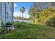 Lawn and equipment in backyard with palm trees visible behind the building at 108 Shore Dr, Tarpon Springs, FL 34689