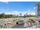 Inviting balcony with scenic water views, complete with stylish seating, potted plants, and outdoor decor at 108 Shore Dr, Tarpon Springs, FL 34689