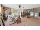 Spacious living room with a stone accent wall and large windows, offering natural light at 108 Shore Dr, Tarpon Springs, FL 34689
