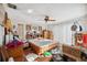 Bright main bedroom with hardwood floors, a ceiling fan, and ample natural light at 108 Shore Dr, Tarpon Springs, FL 34689